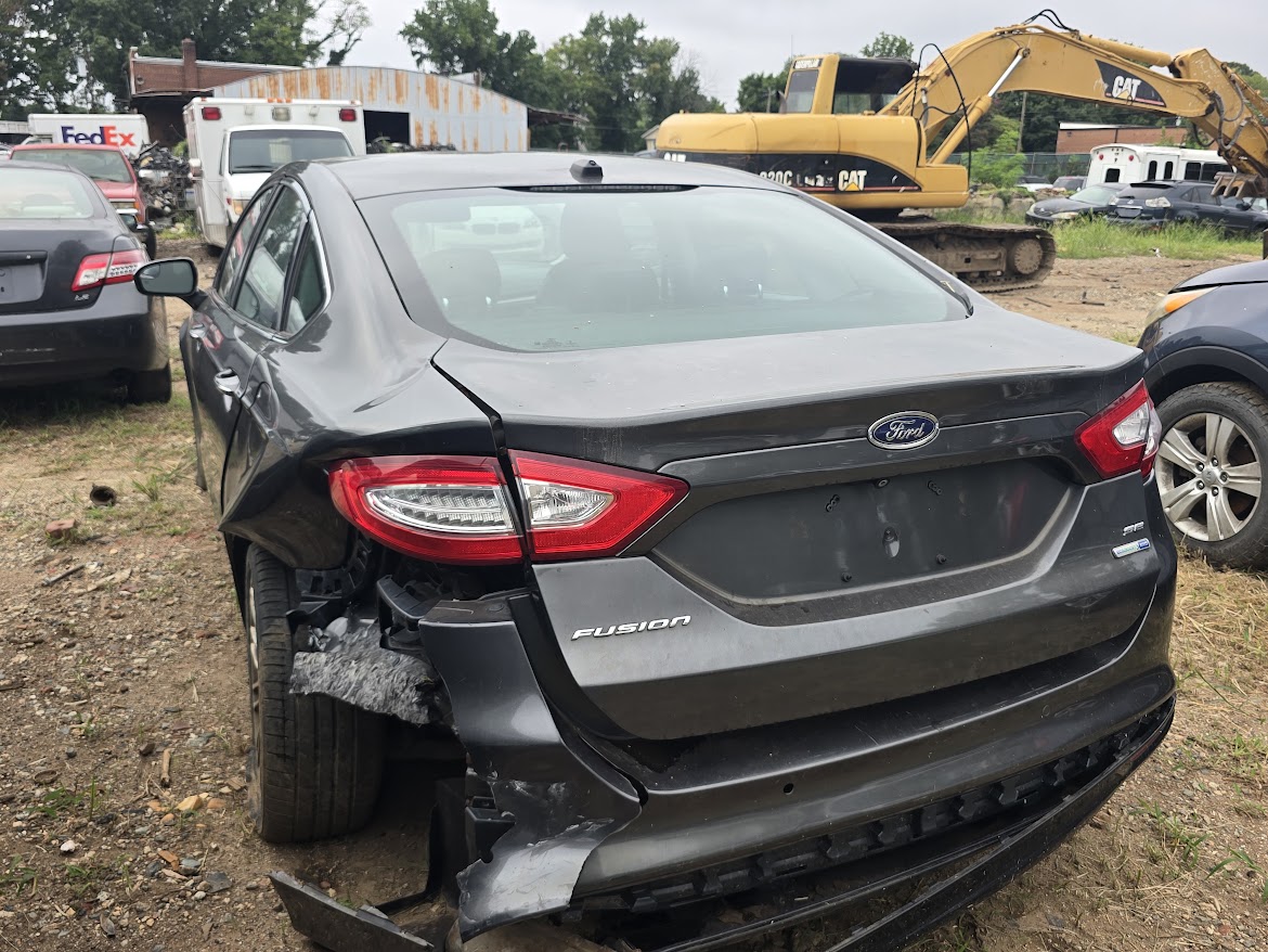 Actual Ford Fusion donor photo 4; rear-left collision damage disclosed